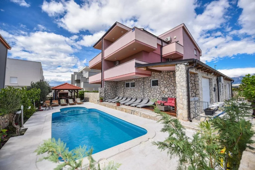 Panoramic view of the pool and terrace at Villa Prince & Tiffany Novalja